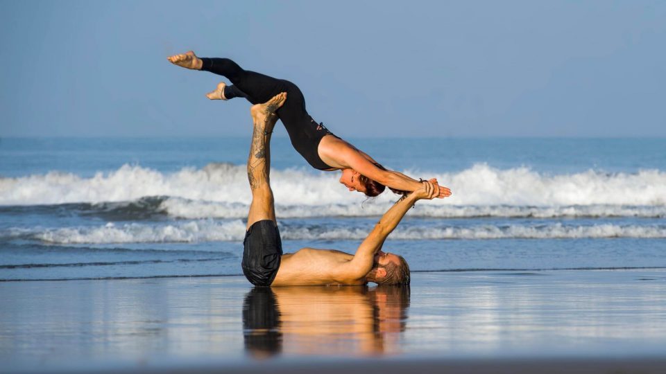 yoga beach pose couple